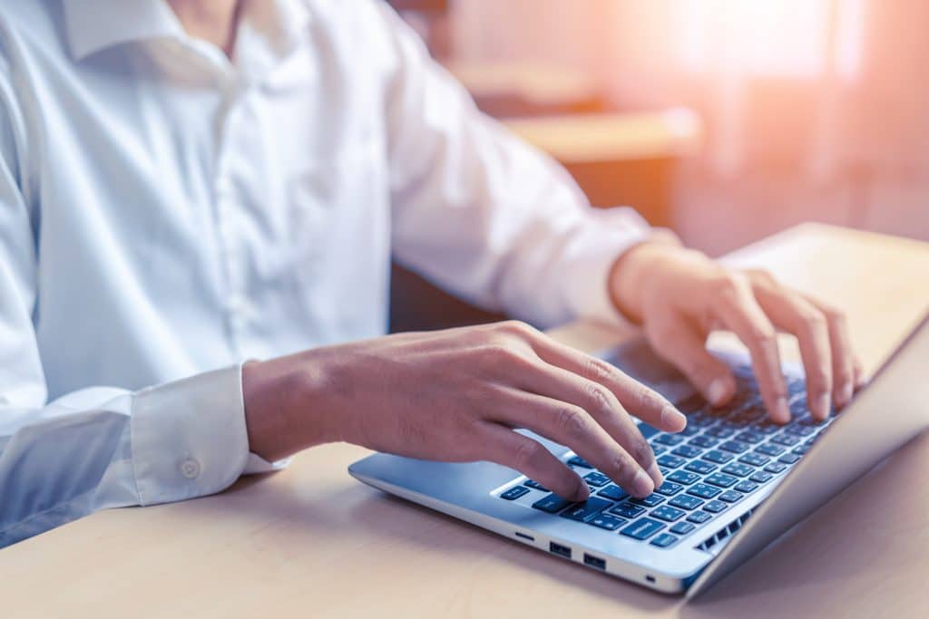 A man typing that is wondering about if he can File a Tax Return with No Income