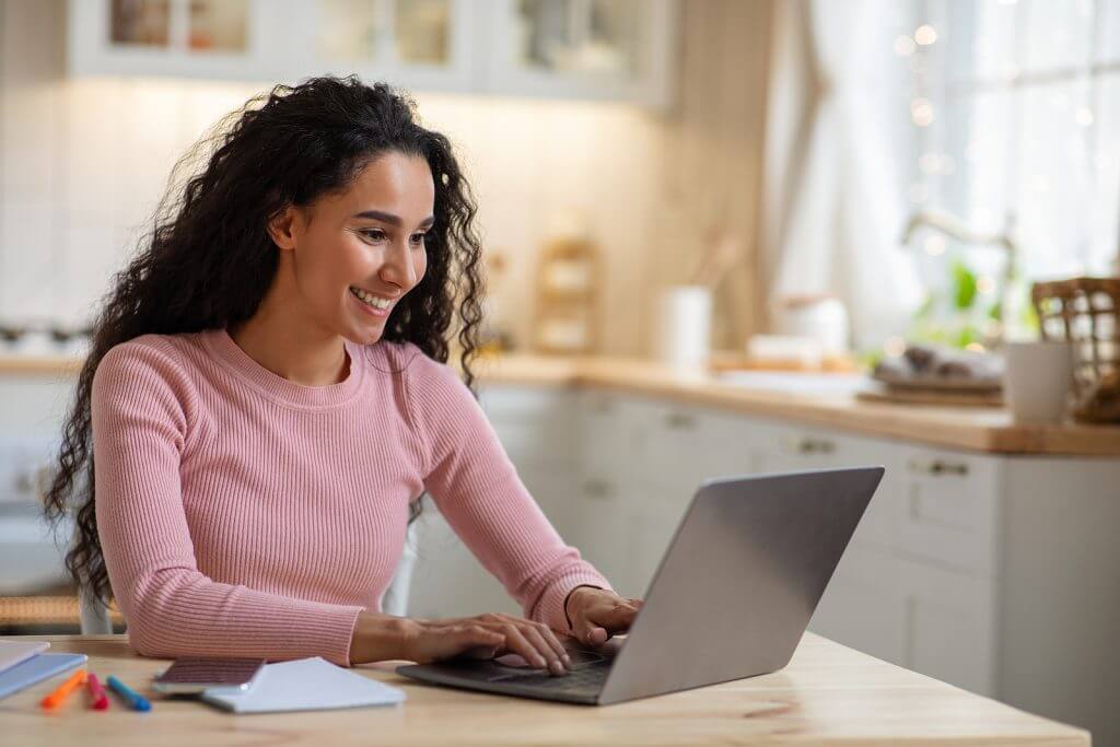 A woman looking at "how to choose the best US Tax Software for expats"