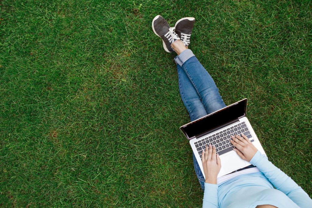 Woman typing on the computer wondering what her tax filing status is for US foreigners