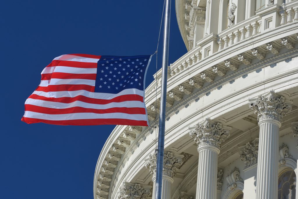 Image of US flag in front of white house to illustrate the biden save plan for expats.