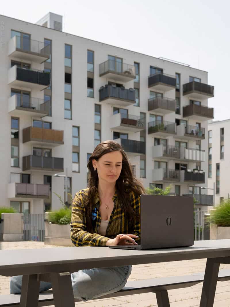 Woman working outside at the MyExpatTaxes office