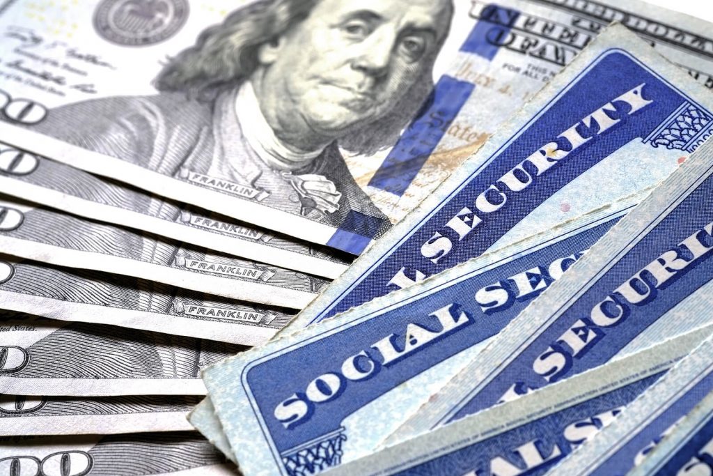 Photo of money and social security papers. This is social security for Americans abroad